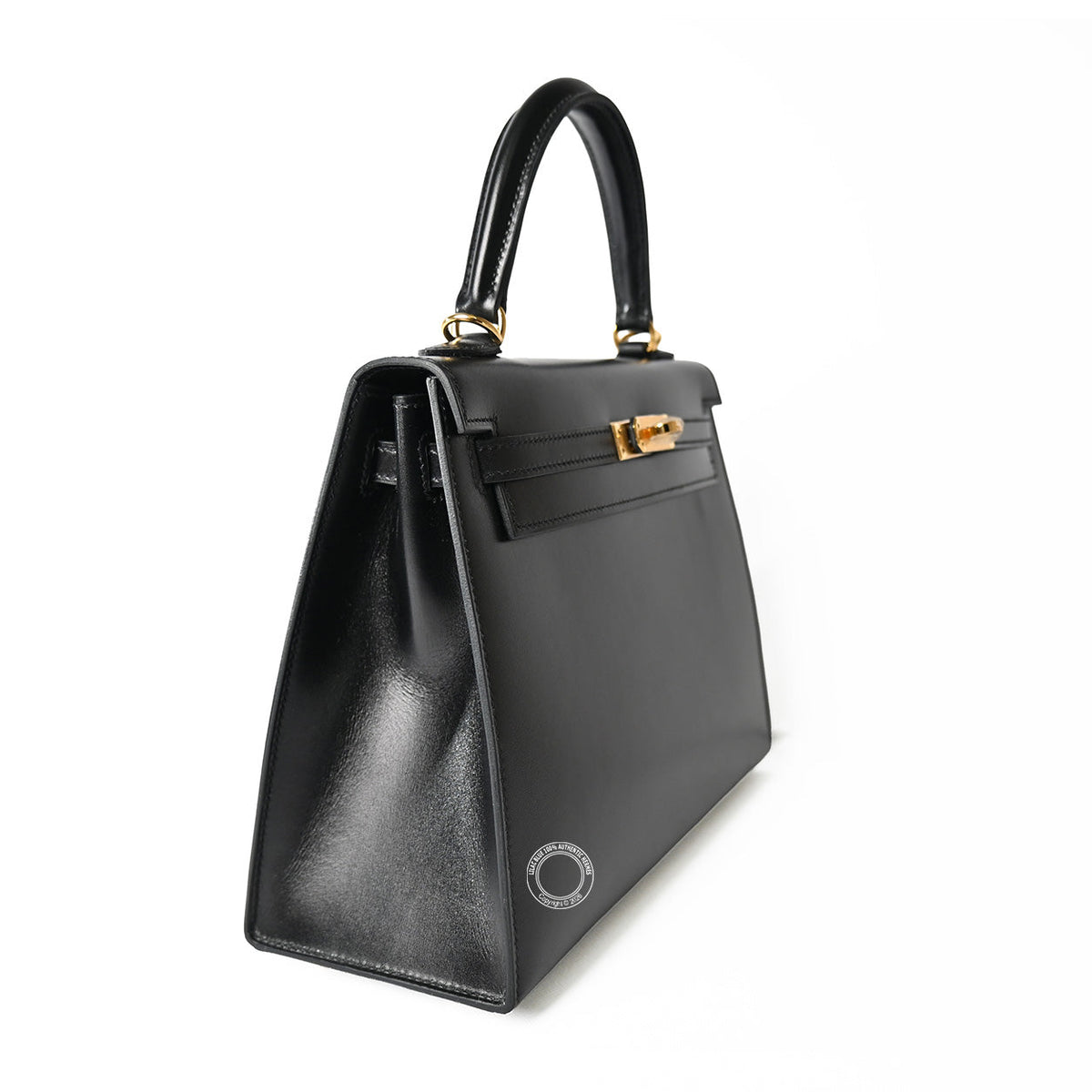 Hermès Kelly 25 in Black Box calfskin leather, three-quarter view showing gold turnlock